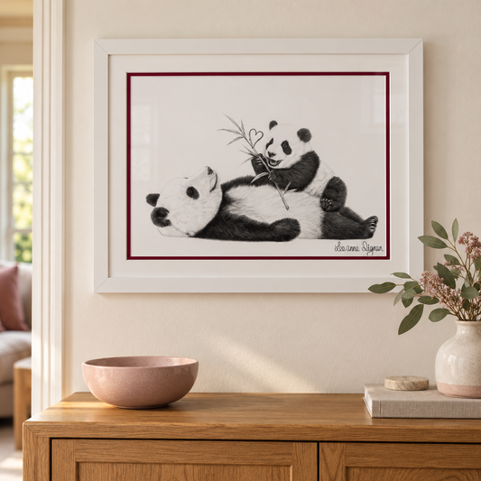 Framed panda artwork styled in a modern home interior